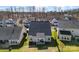 Aerial view of home backyard featuring a covered patio, green lawn, and partial fence at 4866 Breden St, Kannapolis, NC 28081