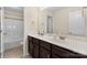 Bathroom featuring a double sink vanity with dark wood cabinets and a shower and toilet at 4866 Breden St, Kannapolis, NC 28081