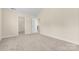 Bedroom with neutral carpet, light walls, and doors to closet and adjoining room at 4866 Breden St, Kannapolis, NC 28081
