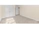 Bedroom features neutral carpet, light walls, double door closet, and ample natural light at 4866 Breden St, Kannapolis, NC 28081
