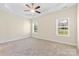 Neutral main bedroom with carpet, fan, and windows at 4866 Breden St, Kannapolis, NC 28081