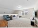 Cozy bonus room featuring plush carpeting, ample seating, and a large window at 4866 Breden St, Kannapolis, NC 28081