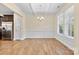 Bright dining room with elegant wainscoting, chandelier, and large windows at 4866 Breden St, Kannapolis, NC 28081