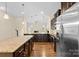 Modern kitchen with granite countertops, stainless steel appliances, and a view to the living area at 4866 Breden St, Kannapolis, NC 28081