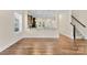 Hardwood floors in living room with view of granite kitchen bar and staircase at 4866 Breden St, Kannapolis, NC 28081