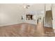 Spacious living room with hardwood floors, ceiling fan and staircase to upper level at 4866 Breden St, Kannapolis, NC 28081