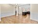 Open-concept living and kitchen area with hardwood floors and ample natural light at 4866 Breden St, Kannapolis, NC 28081