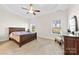 Serene main bedroom featuring a tray ceiling, plush carpet, and generous natural light at 4866 Breden St, Kannapolis, NC 28081