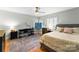 Well-lit bedroom featuring a bed, desk and art studio at 5630 Timber Ln, Charlotte, NC 28270