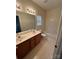 Bathroom featuring a double vanity, a large mirror, and a shower and tub at 5934 Hickory Hollow Ct, Harrisburg, NC 28075
