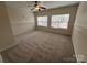 Bedroom featuring large windows, neutral walls, and carpeted floors at 5934 Hickory Hollow Ct, Harrisburg, NC 28075