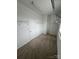 Walk-in closet with white shelving, a carpeted floor, and a white door at 5934 Hickory Hollow Ct, Harrisburg, NC 28075