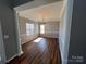 Bright dining room with wood-look floors and a chandelier at 5934 Hickory Hollow Ct, Harrisburg, NC 28075