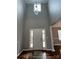 Bright foyer with a high ceiling, decorative chandelier, and a front door flanked by sidelight windows at 5934 Hickory Hollow Ct, Harrisburg, NC 28075