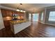 Kitchen with a large island, granite countertops and stainless steel dishwasher at 5934 Hickory Hollow Ct, Harrisburg, NC 28075