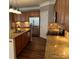 Well-equipped kitchen featuring granite countertops, stainless steel appliances, and wood floors at 5934 Hickory Hollow Ct, Harrisburg, NC 28075