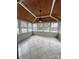 Bright sunroom featuring tile flooring, wood ceiling, multiple windows, and a ceiling fan at 5934 Hickory Hollow Ct, Harrisburg, NC 28075