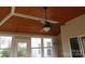 Cozy screened-in porch with wood ceiling, ceiling fan and view of the backyard at 5934 Hickory Hollow Ct, Harrisburg, NC 28075