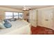 A spacious main bedroom offers deck access, a ceiling fan, and a large wardrobe at 615 Portside Dr, Davidson, NC 28036