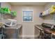 Well-organized laundry room with modern washer/dryer, shelving, window and decorative touches at 640 Morningside Dr, Chester, SC 29706