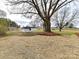 Expansive backyard with mature trees and storage shed at 7514 Highway 205 Hwy, Marshville, NC 28103