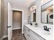 Bright bathroom featuring a double vanity, and a black shower curtain with a tile floor at 7514 Highway 205 Hwy, Marshville, NC 28103