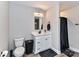 Bright bathroom featuring a single vanity and a black shower curtain with a tile floor at 7514 Highway 205 Hwy, Marshville, NC 28103