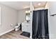 Neutral colored bathroom featuring tile flooring, shower, vanity and toilet at 7514 Highway 205 Hwy, Marshville, NC 28103