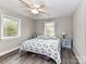 Bright bedroom with a ceiling fan and windows on two walls at 7514 Highway 205 Hwy, Marshville, NC 28103