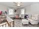 This charming bedroom features a ceiling fan, a window, and beautiful wood floors at 7514 Highway 205 Hwy, Marshville, NC 28103