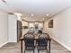 Dining area connects the kitchen and living area with chairs around a wooden table at 7514 Highway 205 Hwy, Marshville, NC 28103