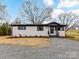 Charming renovated home featuring a painted brick facade, dark accents, and new landscaping at 7514 Highway 205 Hwy, Marshville, NC 28103