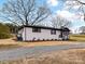 Charming renovated home featuring a painted brick facade, dark accents, and new landscaping at 7514 Highway 205 Hwy, Marshville, NC 28103