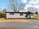 Charming renovated home featuring a painted brick facade, dark accents, and new landscaping at 7514 Highway 205 Hwy, Marshville, NC 28103