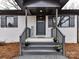 Cozy front porch features decorative flower pots, a 'welcome' sign, and a modern front door at 7514 Highway 205 Hwy, Marshville, NC 28103