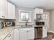Kitchen view featuring stainless steel appliances, granite countertops, and stylish white cabinetry at 7514 Highway 205 Hwy, Marshville, NC 28103