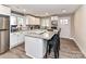Bright, open kitchen with white cabinets, stainless steel appliances, and an eat-in island at 7514 Highway 205 Hwy, Marshville, NC 28103