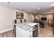 Kitchen island featuring countertop range and seating that connects to the dining and living area at 7514 Highway 205 Hwy, Marshville, NC 28103