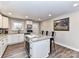 Well-lit kitchen featuring white cabinets, granite countertops, and stainless steel appliances at 7514 Highway 205 Hwy, Marshville, NC 28103