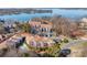 Stunning aerial view of lakeside condos, featuring beautiful lake views and community pool at 753 Southwest Dr, Davidson, NC 28036