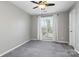 A bedroom bathed in natural light features plush carpeting and a charming window view at 753 Southwest Dr, Davidson, NC 28036