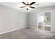 Cozy bedroom featuring a sliding door to a screened porch and fan to keep you cool at 753 Southwest Dr, Davidson, NC 28036