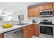 Bright kitchen featuring wood cabinets, stainless steel appliances, and white countertops at 753 Southwest Dr, Davidson, NC 28036