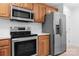 Stainless steel appliances and wood cabinets in kitchen at 753 Southwest Dr, Davidson, NC 28036