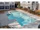 Community pool with lounge chairs and nearby townhomes at 753 Southwest Dr, Davidson, NC 28036
