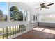 Spacious enclosed porch with paneled walls and several view windows at 753 Southwest Dr, Davidson, NC 28036