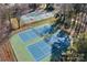 Aerial view of community tennis courts surrounded by trees at 753 Southwest Dr, Davidson, NC 28036