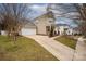 Traditional two-story home with a well-manicured front yard and attached two car garage at 7602 Rolling Meadows Ln, Huntersville, NC 28078