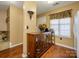 Wood floors and a wooden cabinet in the entryway at 7677 Petrea Ln # 2904, Charlotte, NC 28227