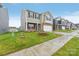 Street view of new two-story homes with brick accents, siding, garages and landscaped lawns at 8032 Plymouth Dr, Sherrills Ford, NC 28673
